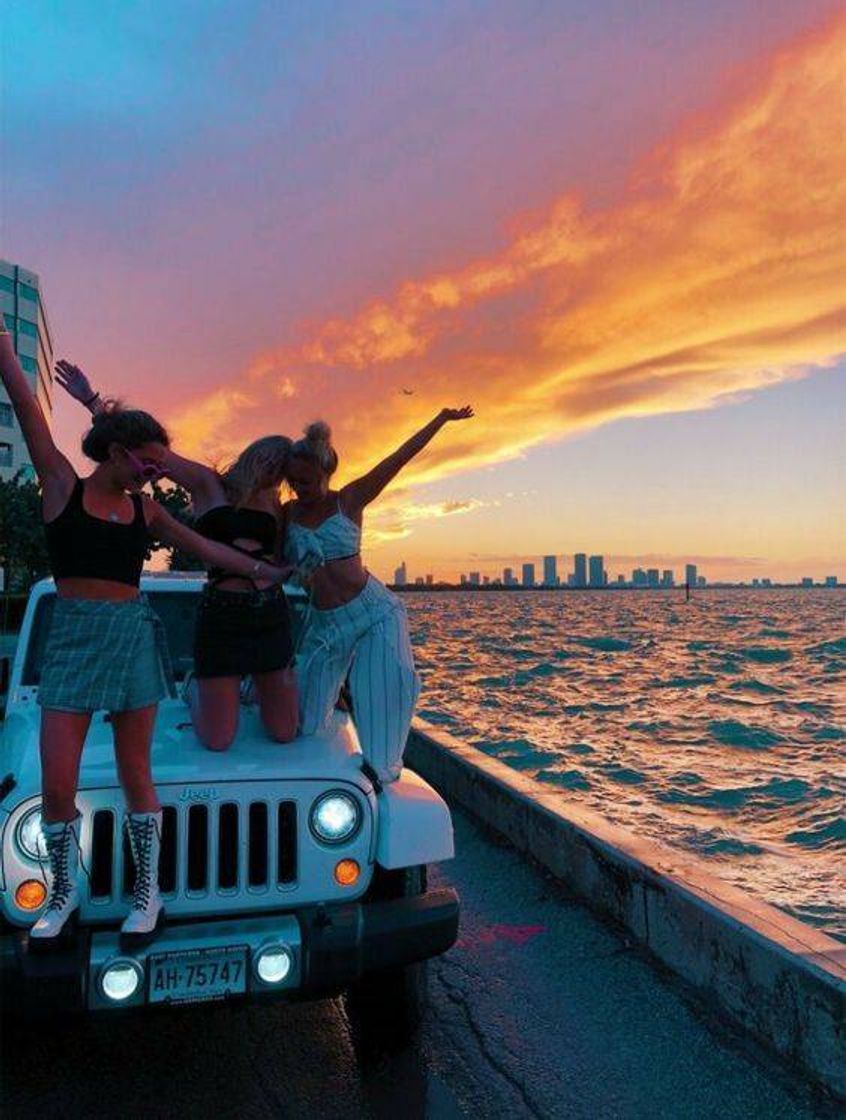 Fashion car vibe at sunset on the beach