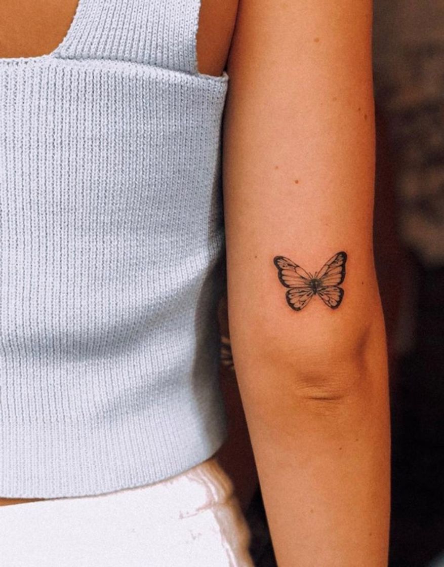 Fashion Butterfly tattoo on the back of the right arm.