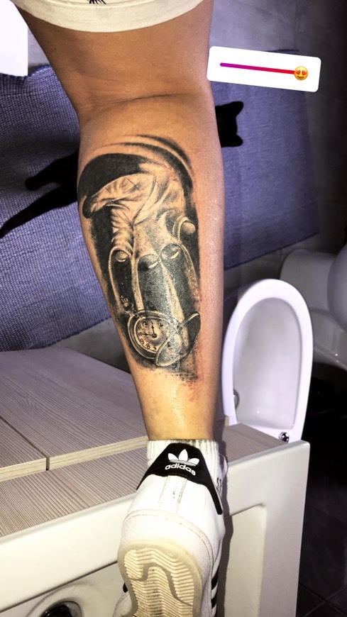 Hand and clock tatoo