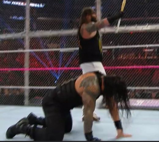 Román Reings battles Bray Wyatt inside Hell in a cell