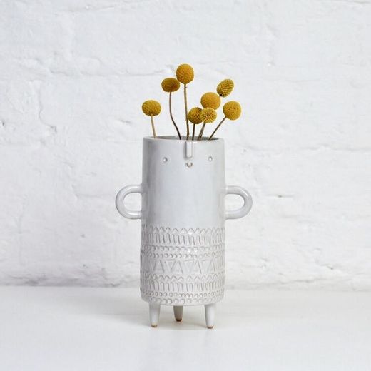 Tall stamped tripod vase with arms