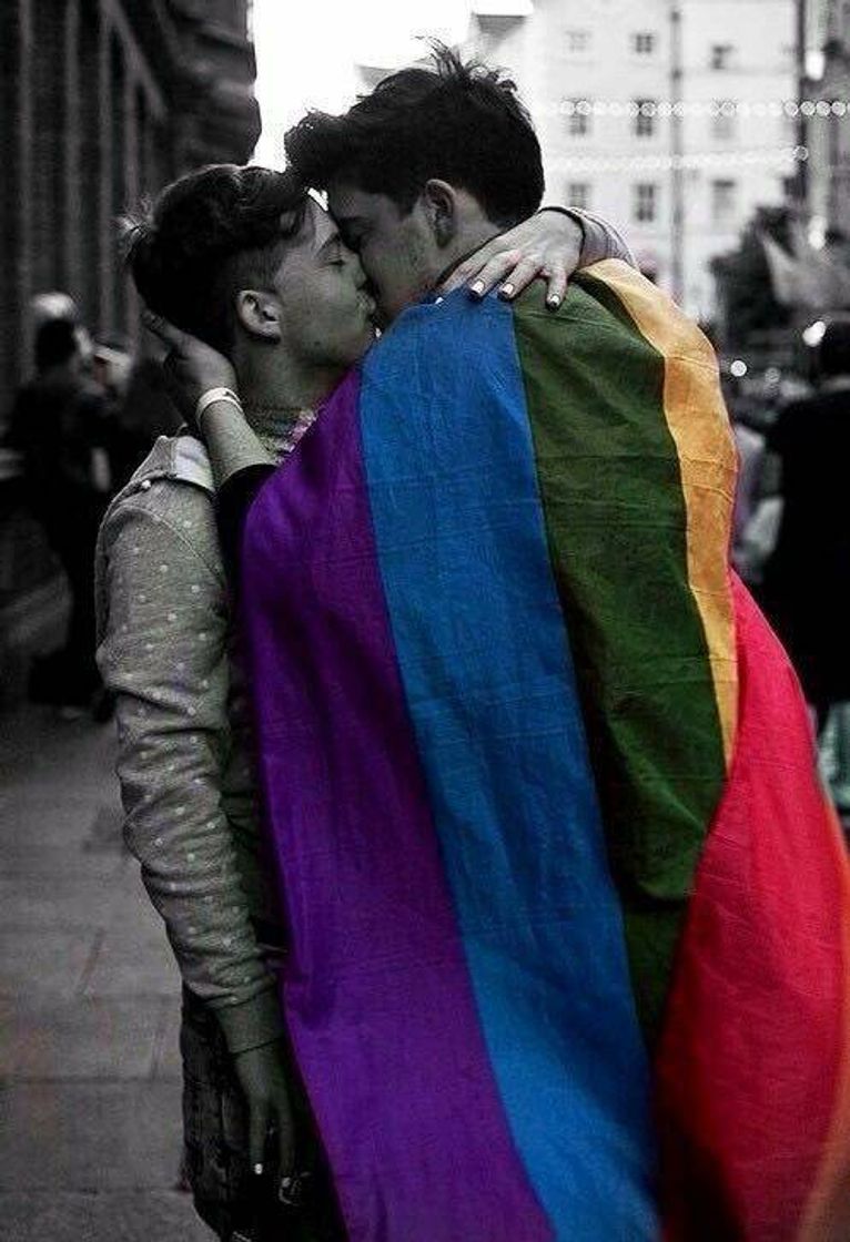 Fashion Gay couple kissing in a lgbtqiap+ parade