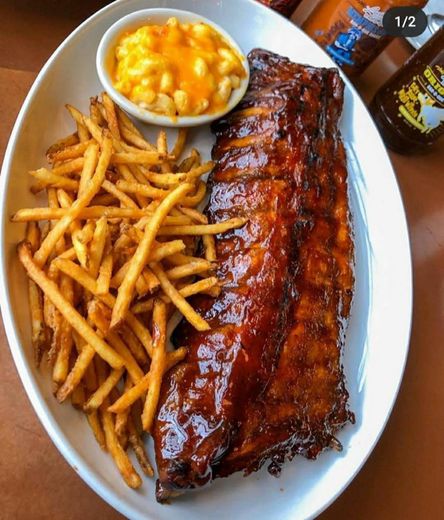 Ribs with barbecue sauce french fries and macaroni and chees