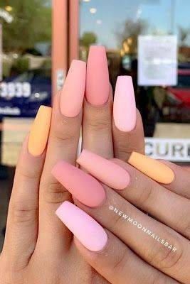 Colorful nails in various shades of pink and yellow 