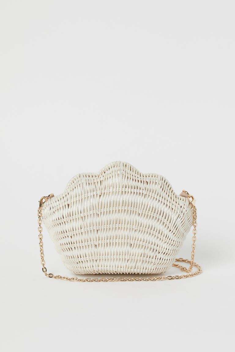 Producto Clutch em forma de concha



