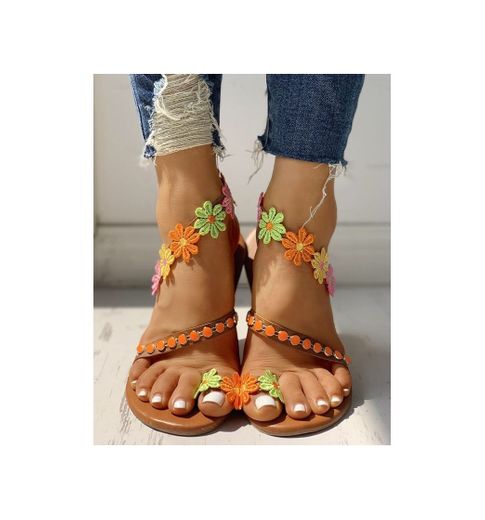 
Sandalias planas con adornos de flores en el dedo del pie
