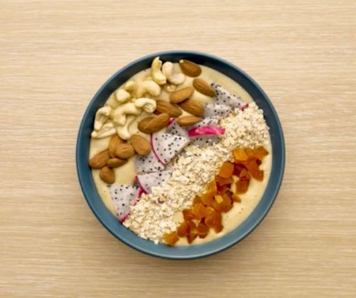 Golden Buddha Bowl with Almonds, Cashews and Dried Apricots