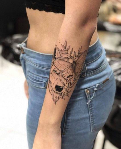 Wolf and butterfly tattoo