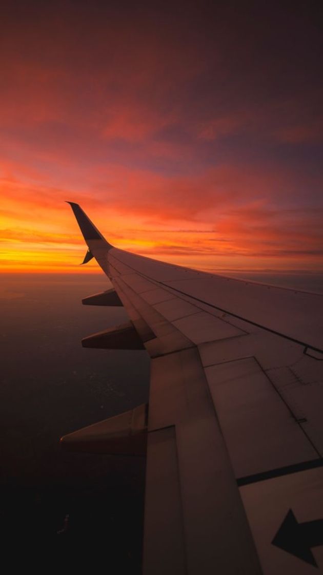 Fashion watching the sunset from an airplane