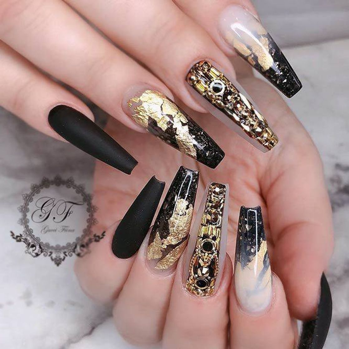 Fashion nails decorated with black and gold